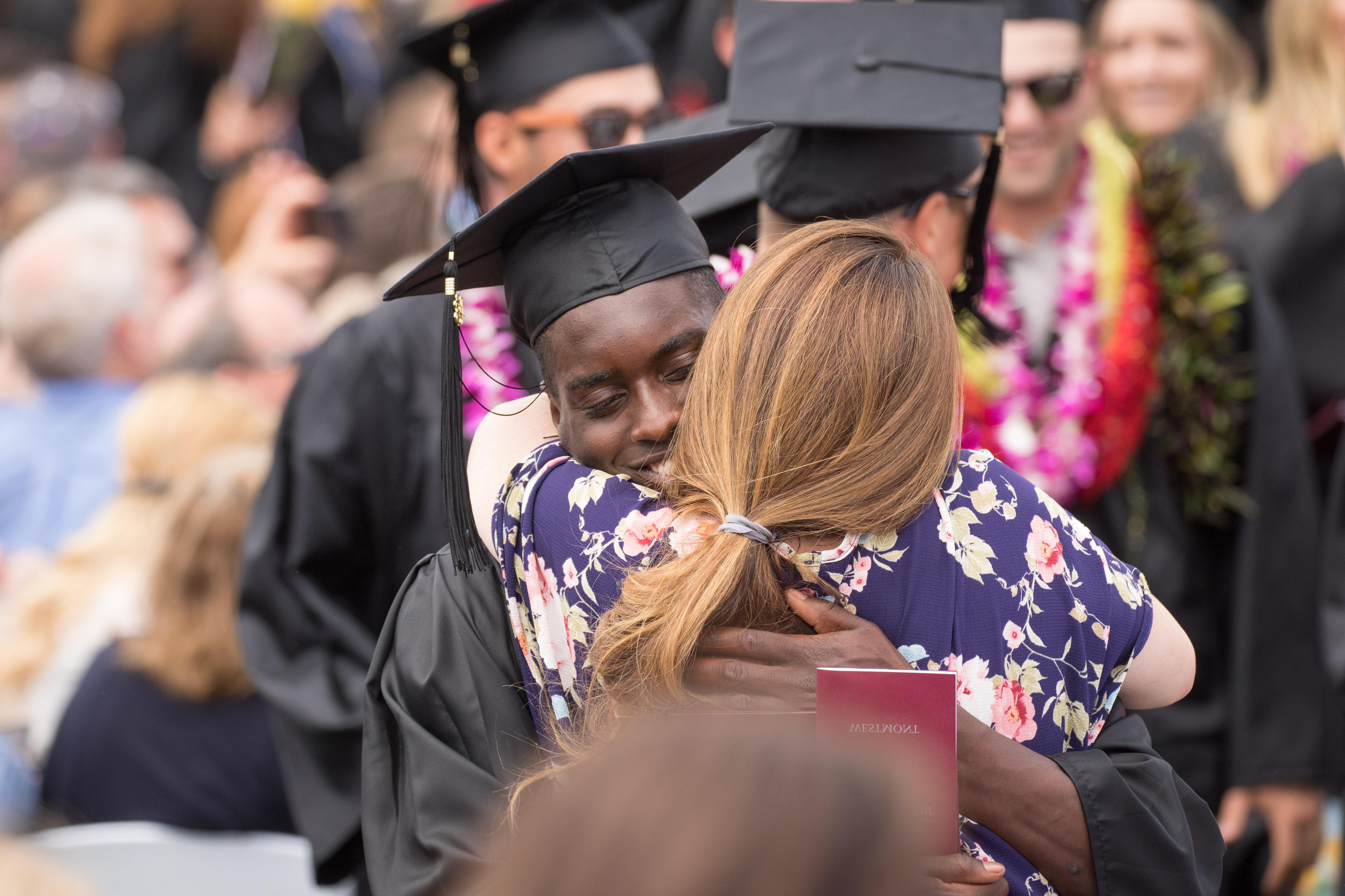 Student hugging at commencement